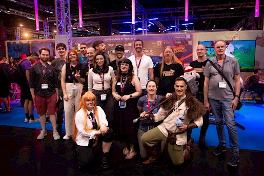 The Road to gamescom participants, Jens Unrau, head of the Hamburg Media Office (on the right), and the Gamecity Hamburg team in front of the Gamecity booth